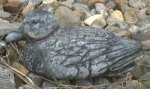 [A real photo of a stone duck]